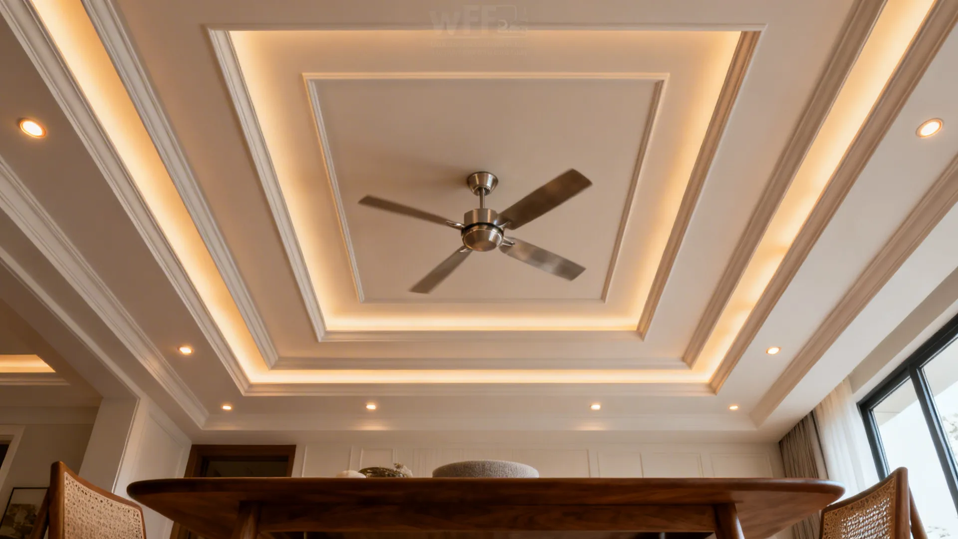Dining room with a shallow coffered ceiling grid and a central ceiling fan.
