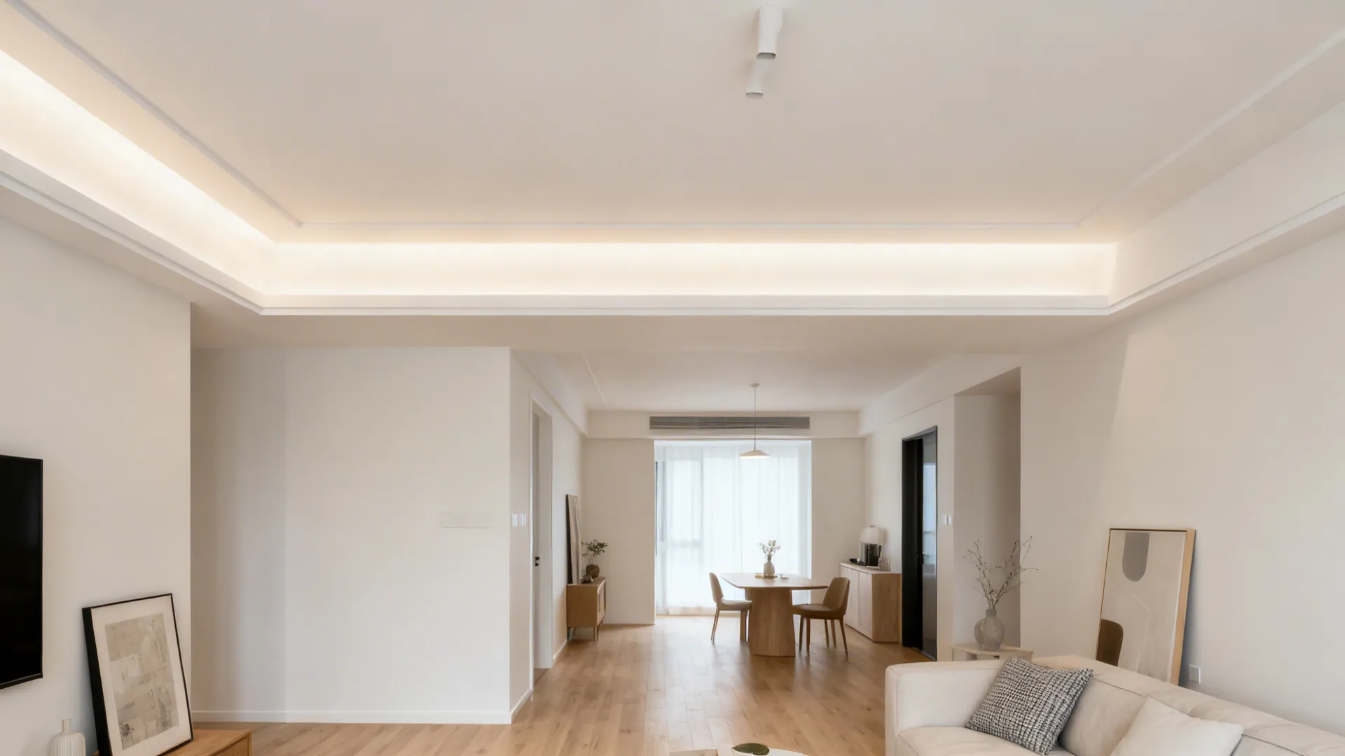 Painted ceiling border creates a floating panel effect in a compact drawing room.