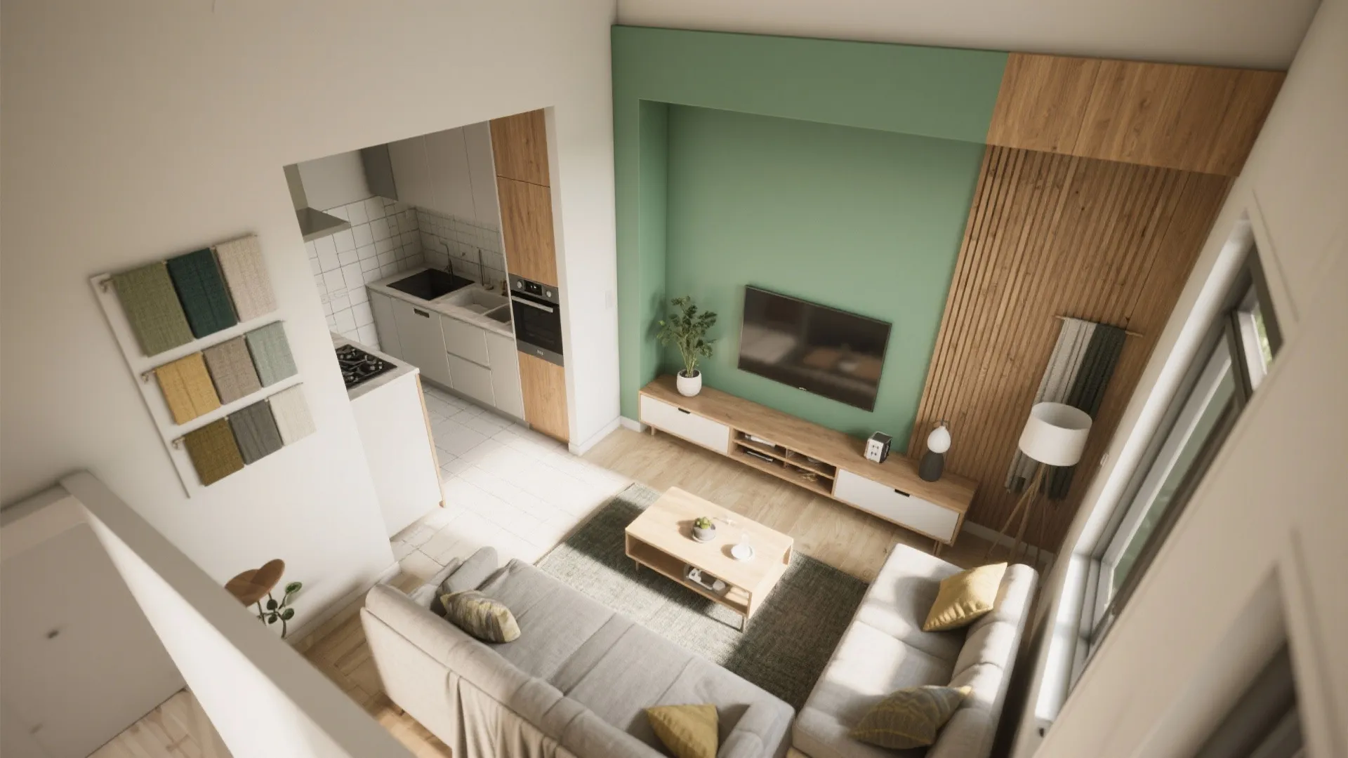 Modern open plan living room layout with green accent wall grey sofa and small white kitchen