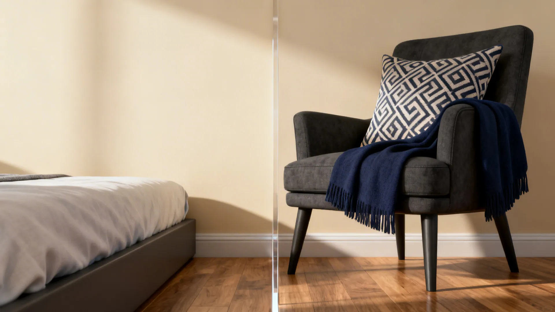 Bedside and armchair showing warm neutrals with high-contrast navy accent for visibility.