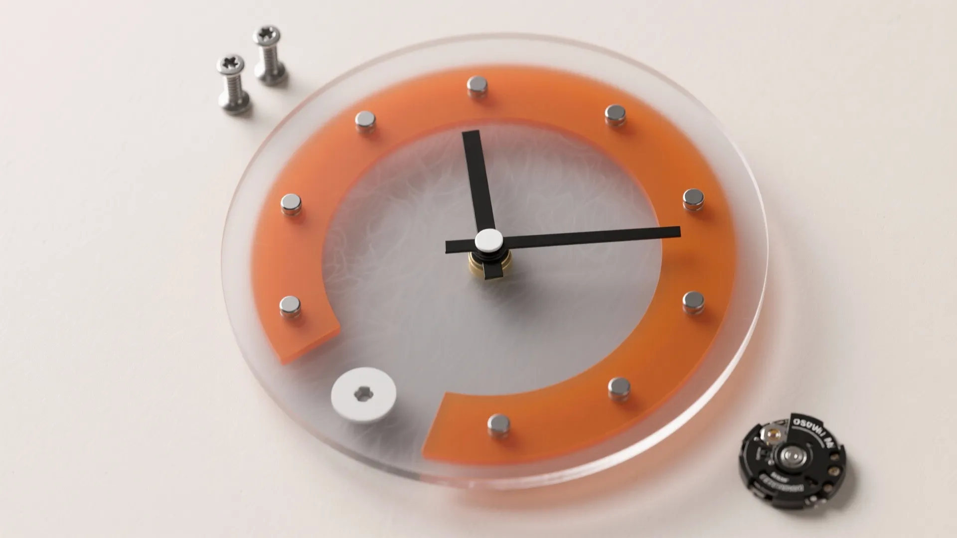 Round glass wall clock with orange design and black hands placed on a white table