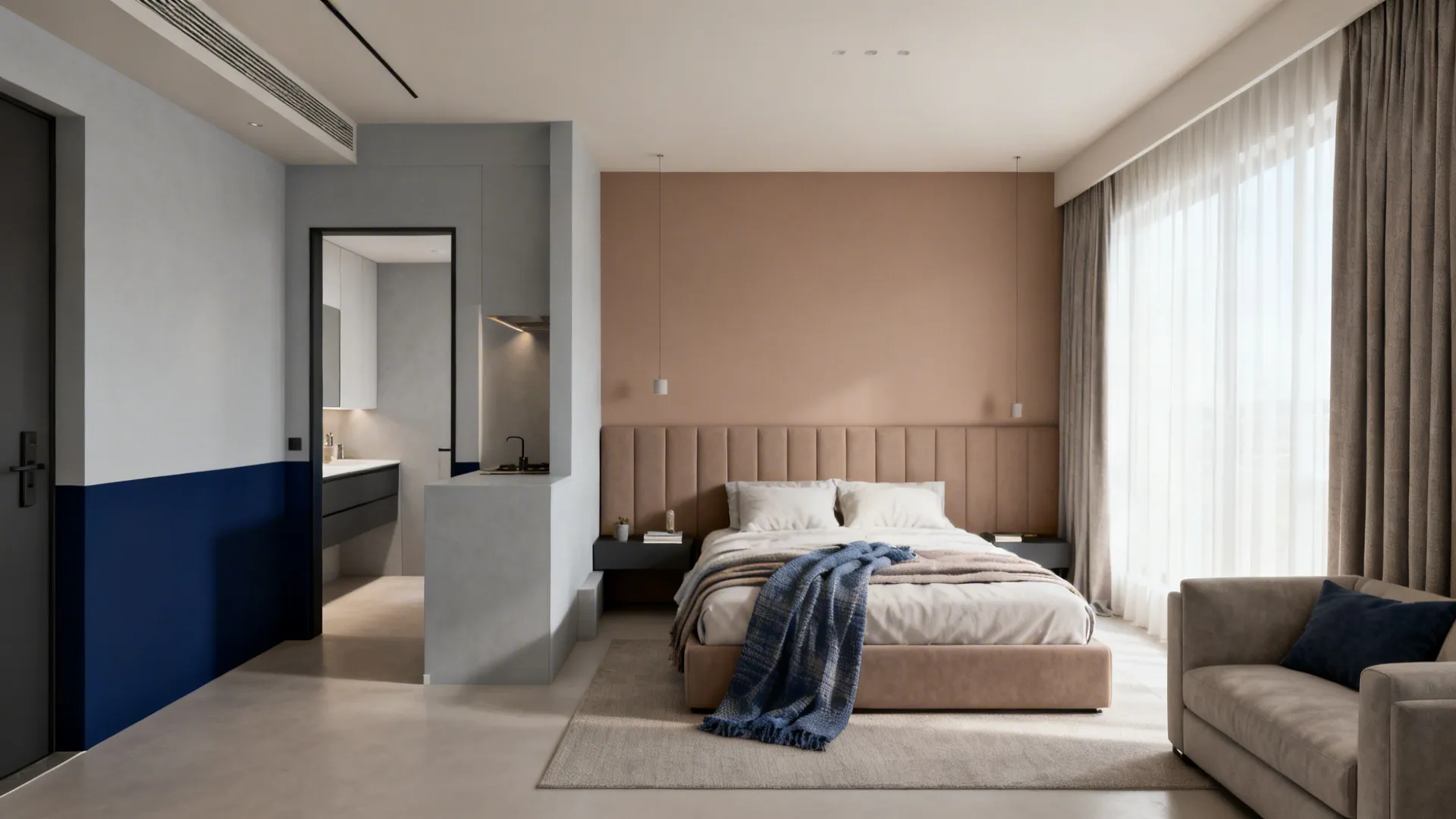 Small studio with taupe headboard wall, pale gray living corner, and a navy entry band.