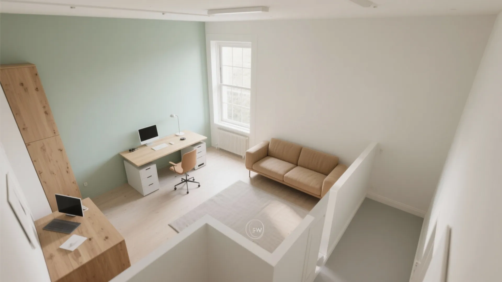 Home office with green wall, wooden desk, tan sofa, and window with soft natural light