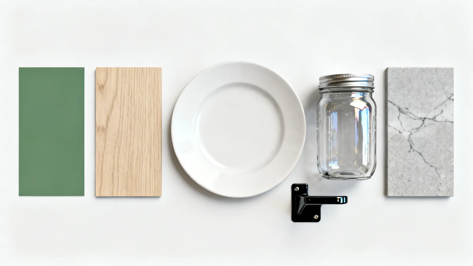 Flat-lay with green paint, pale oak, white ceramic, clear glass, black bracket, and gray stone samples.