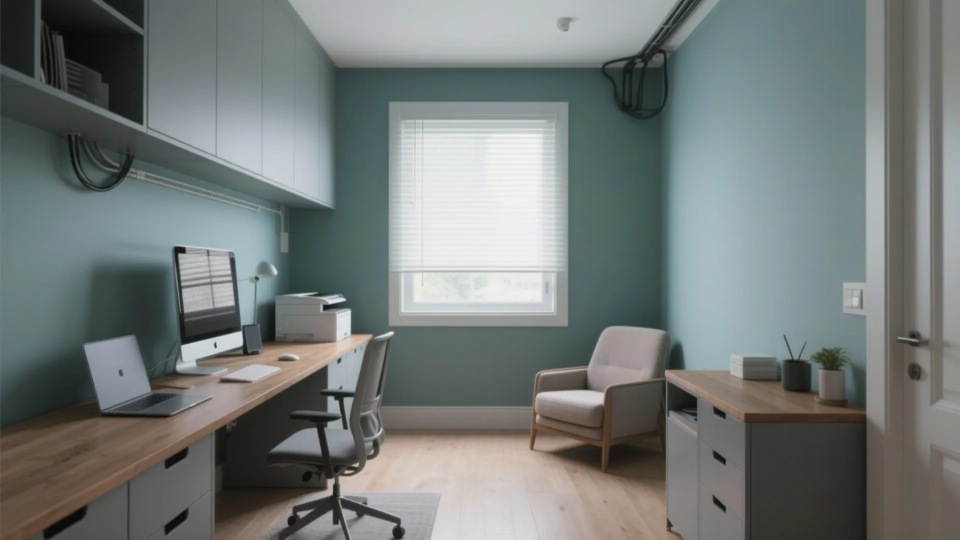 Modern home office with teal walls wooden desk white window blinds grey chair and storage cabinets
