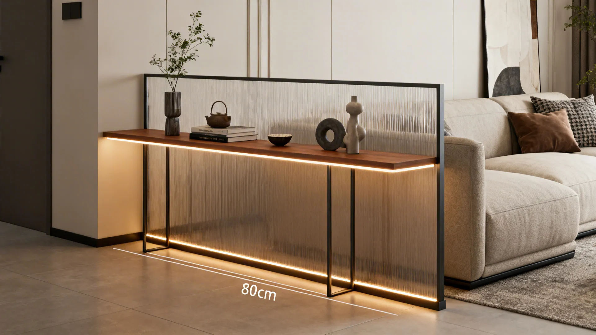 Slim console table with integrated lighting used as a half-height partition behind a sofa.