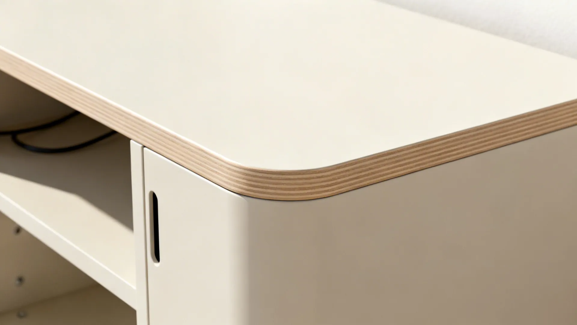 Close up of a cream cabinet with rounded corner and layered wood edge detail view
