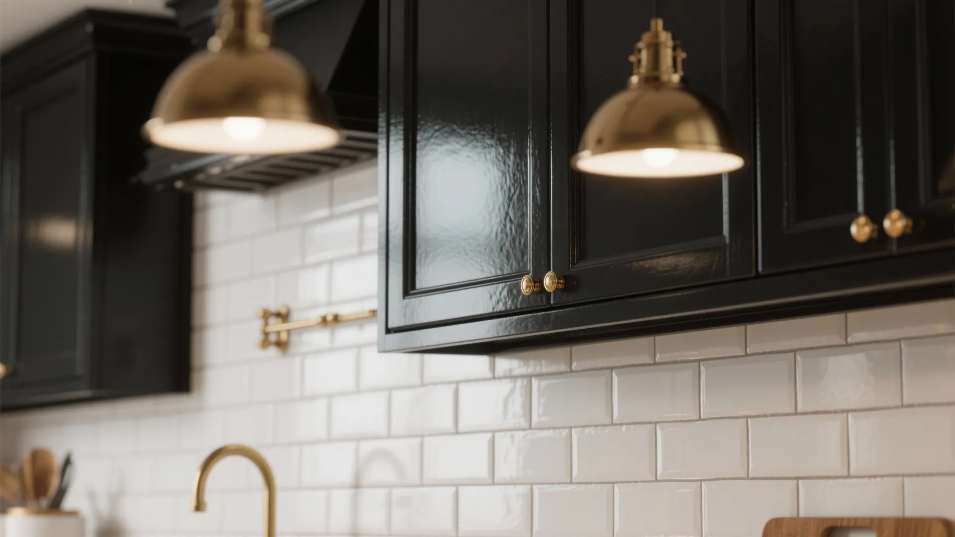 1. High-contrast cabinetry with reflective backsplashes