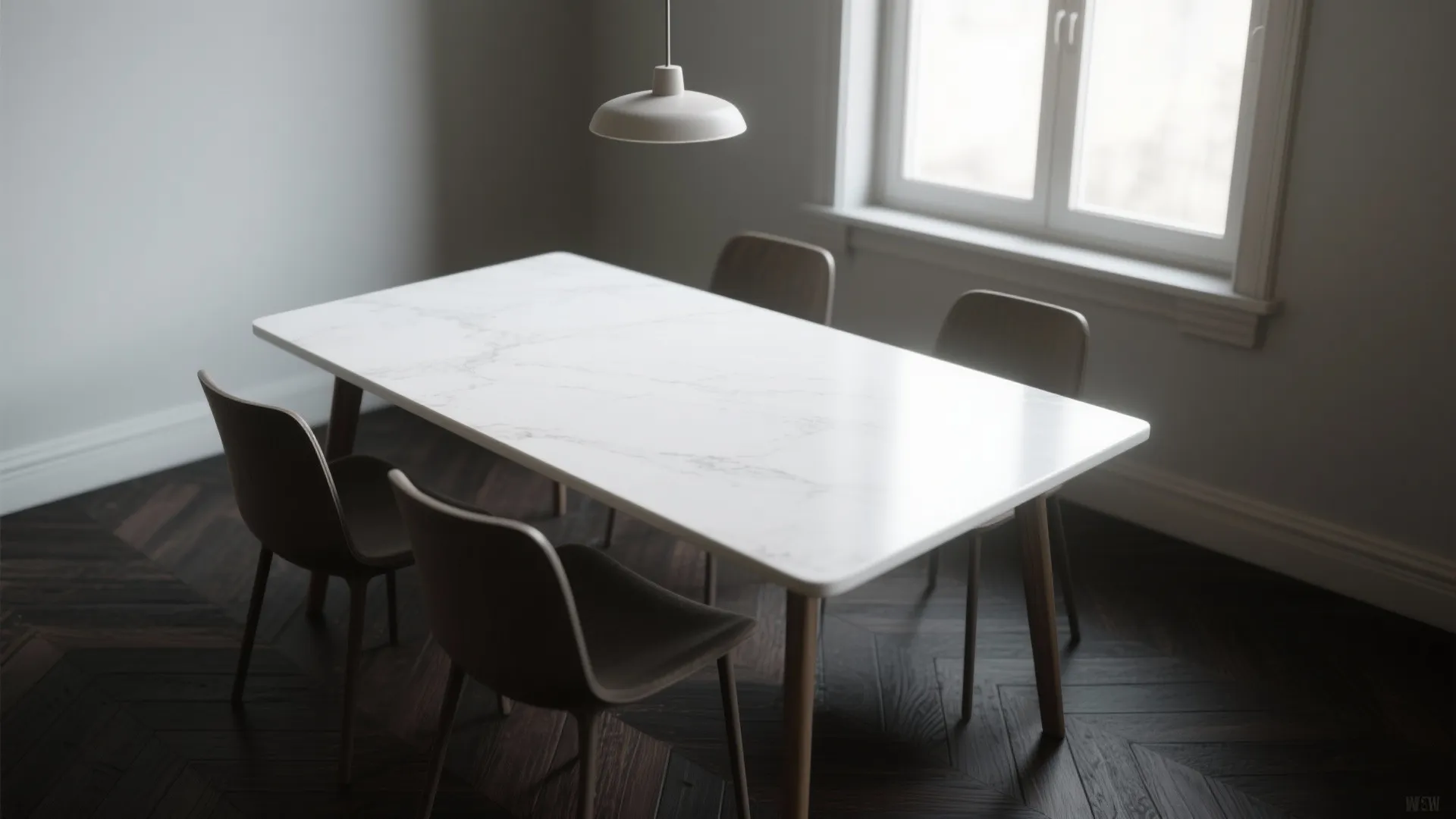 White marble dining table with four dark chairs on dark wood floor under a light