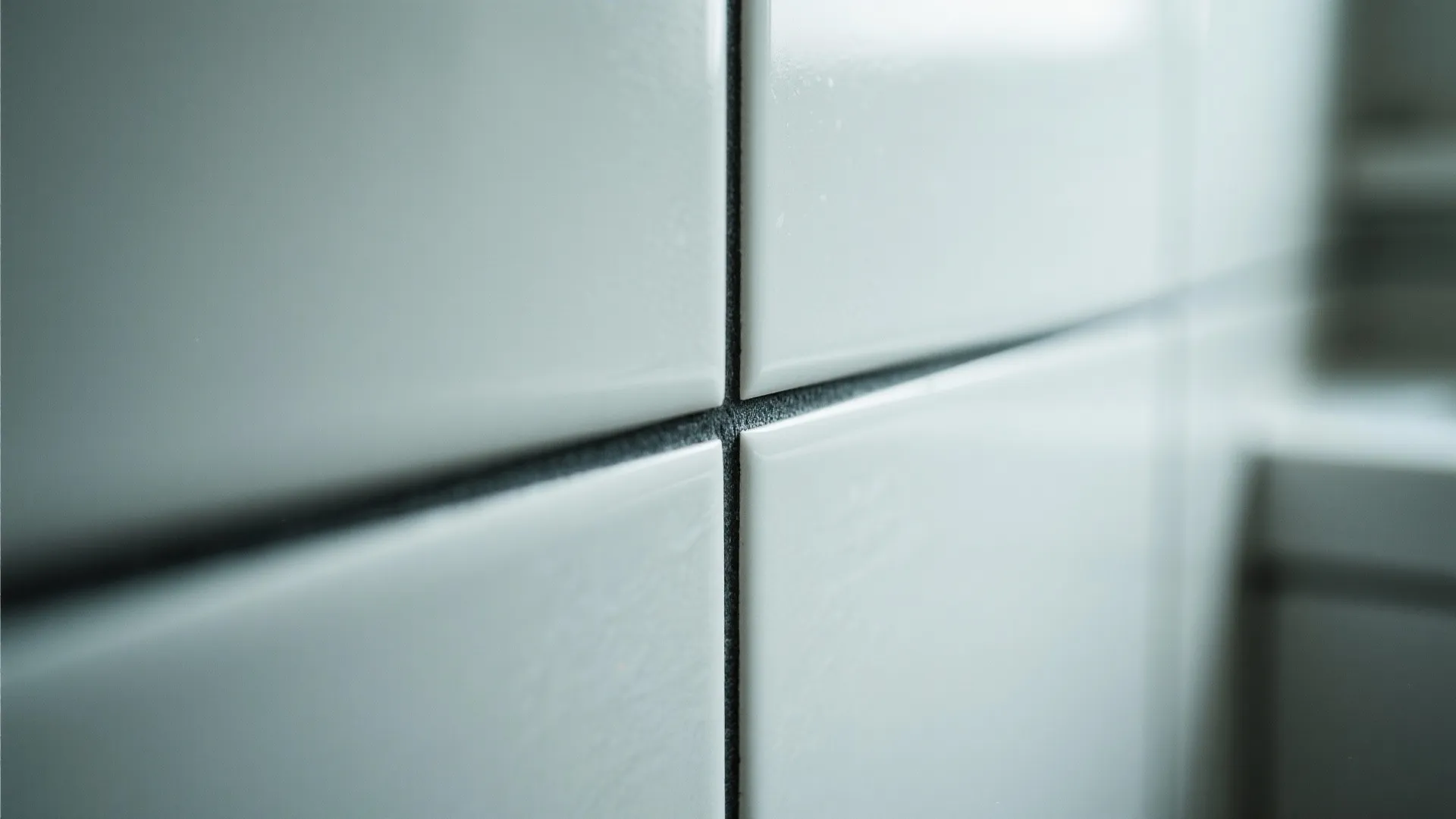 Close-up of light tiles with dark grout for bold geometry