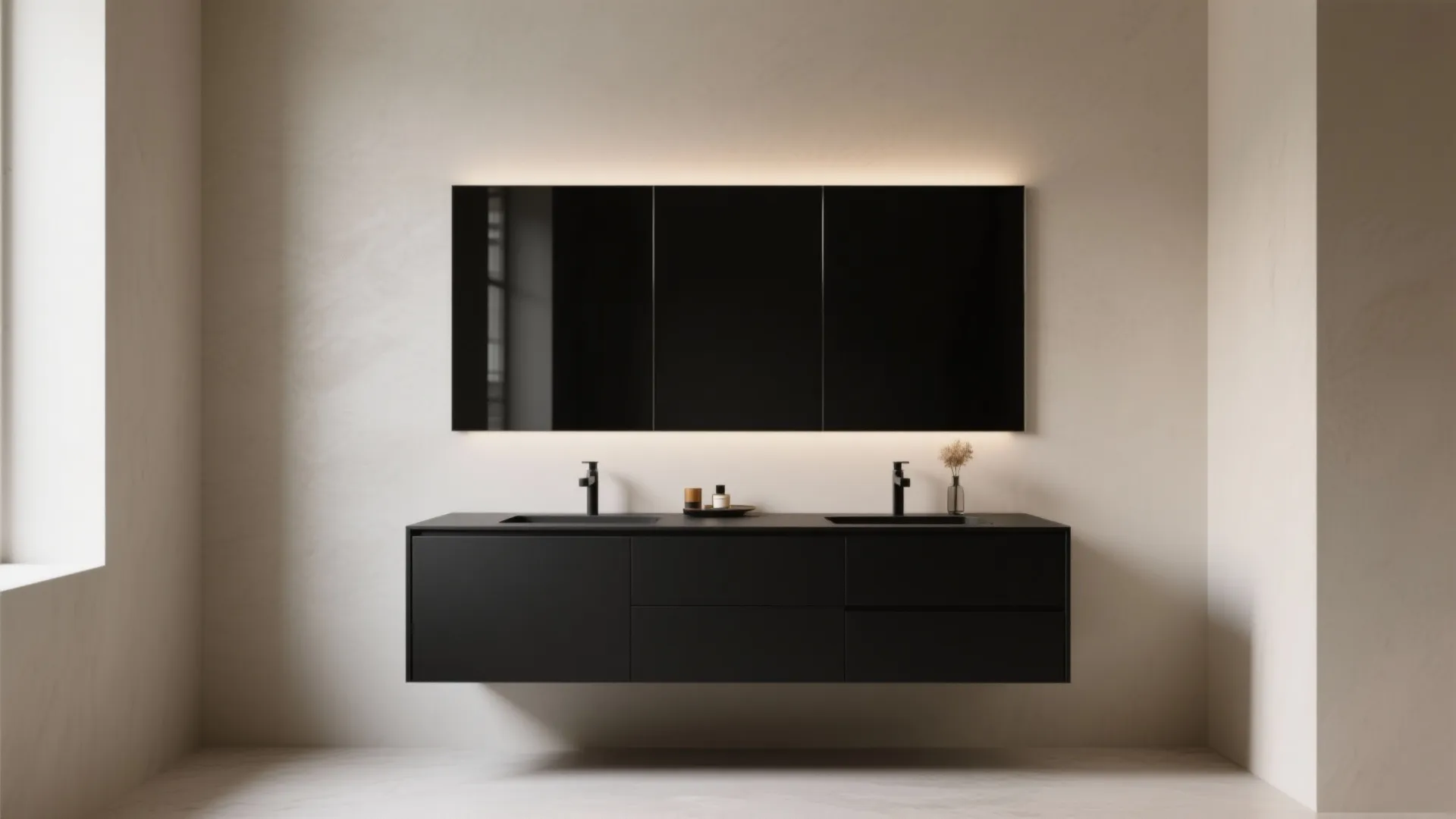 Minimalist bathroom showing a black floating cabinet with two sinks under a large black mirror