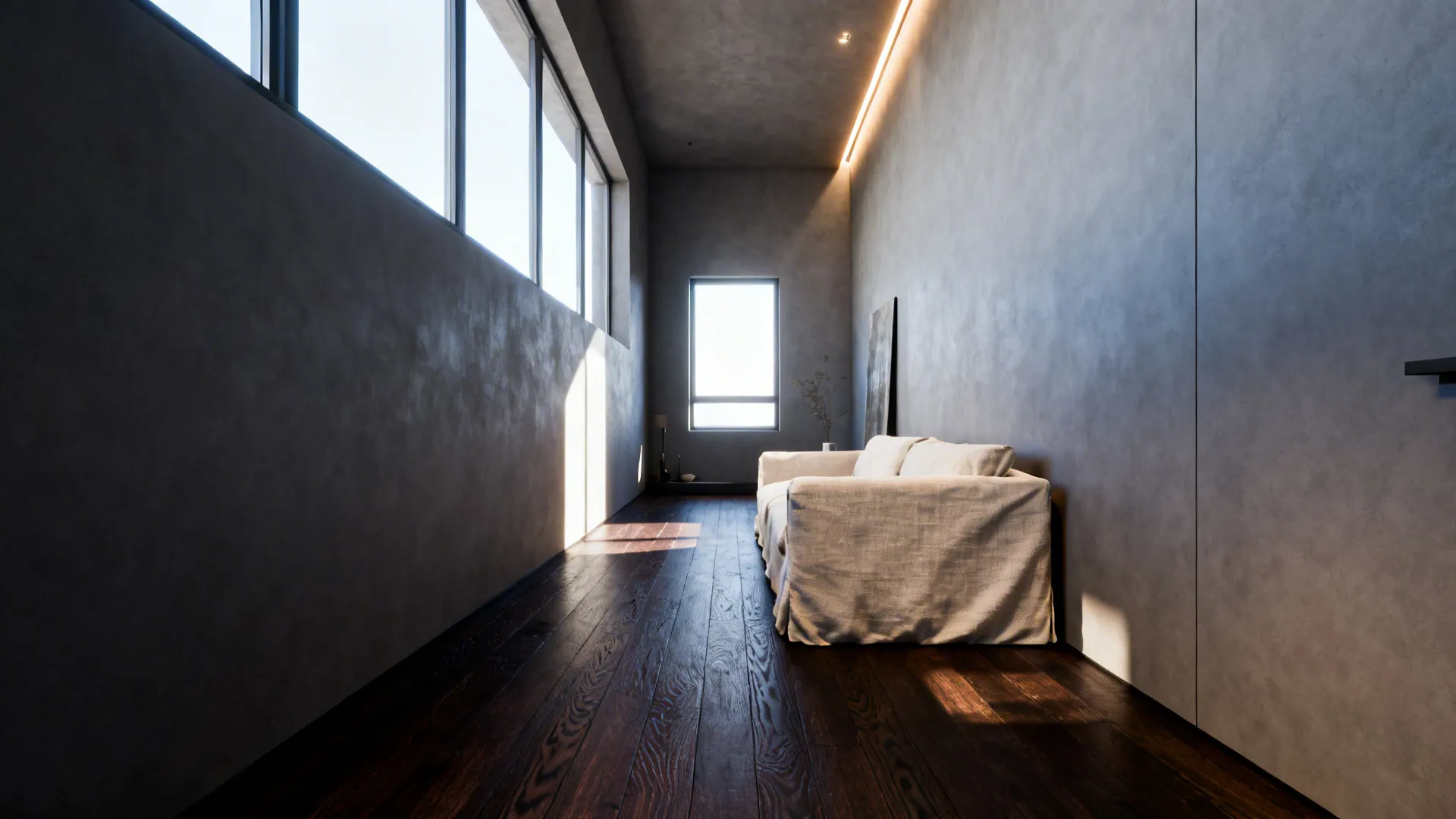 Narrow loft with dark floors, pale linen sofa, and soft gray walls creating crisp contrast.