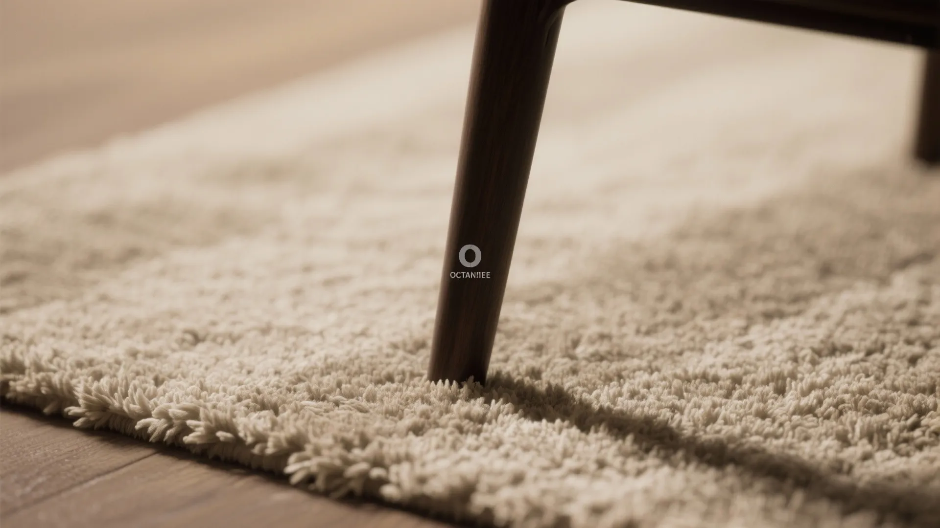 Close up of a wooden furniture leg standing on a soft cream rug with sunlight