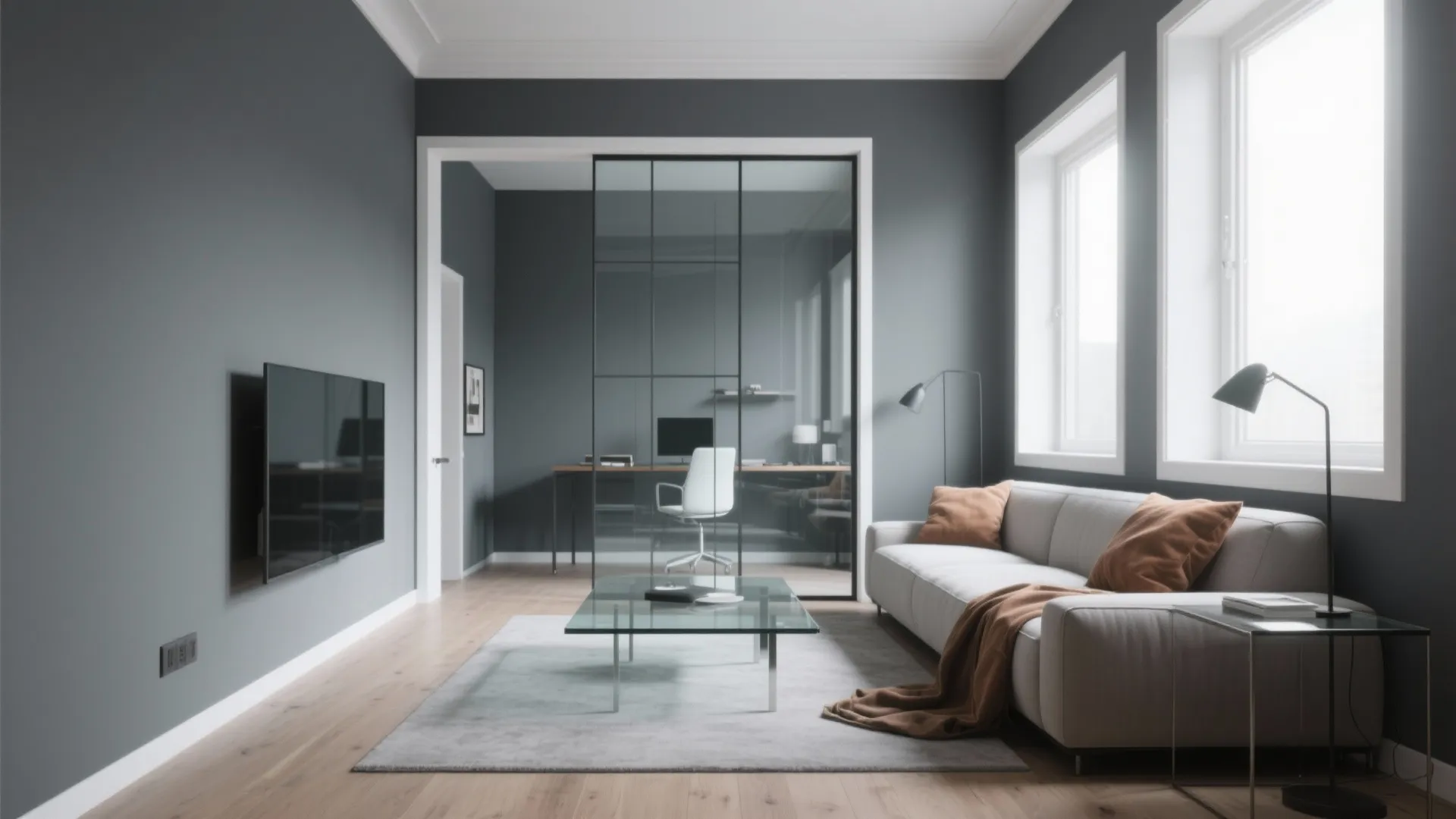 Modern grey living room with sofa, glass coffee table, television, and glass wall office area