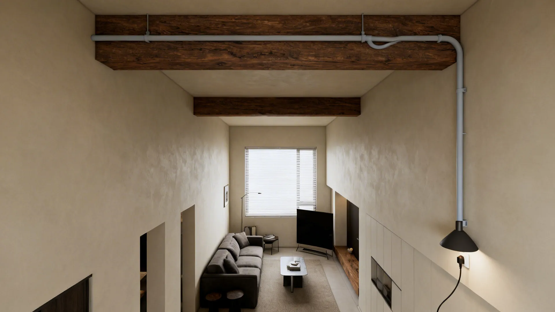 Living room with a painted conduit running along an exposed beam routing a plug-in pendant cord.
