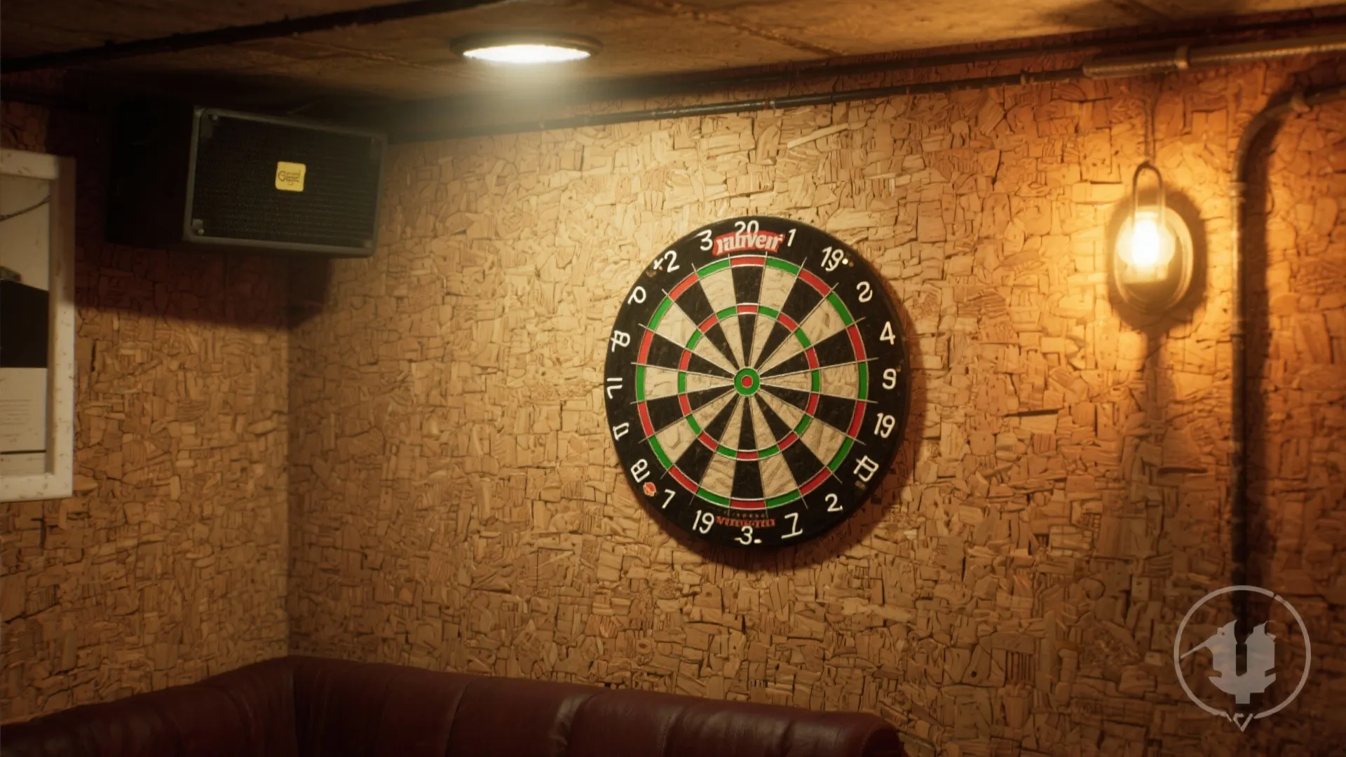 Dartboard mounted on a textured cork wall with a wall light and a black speaker