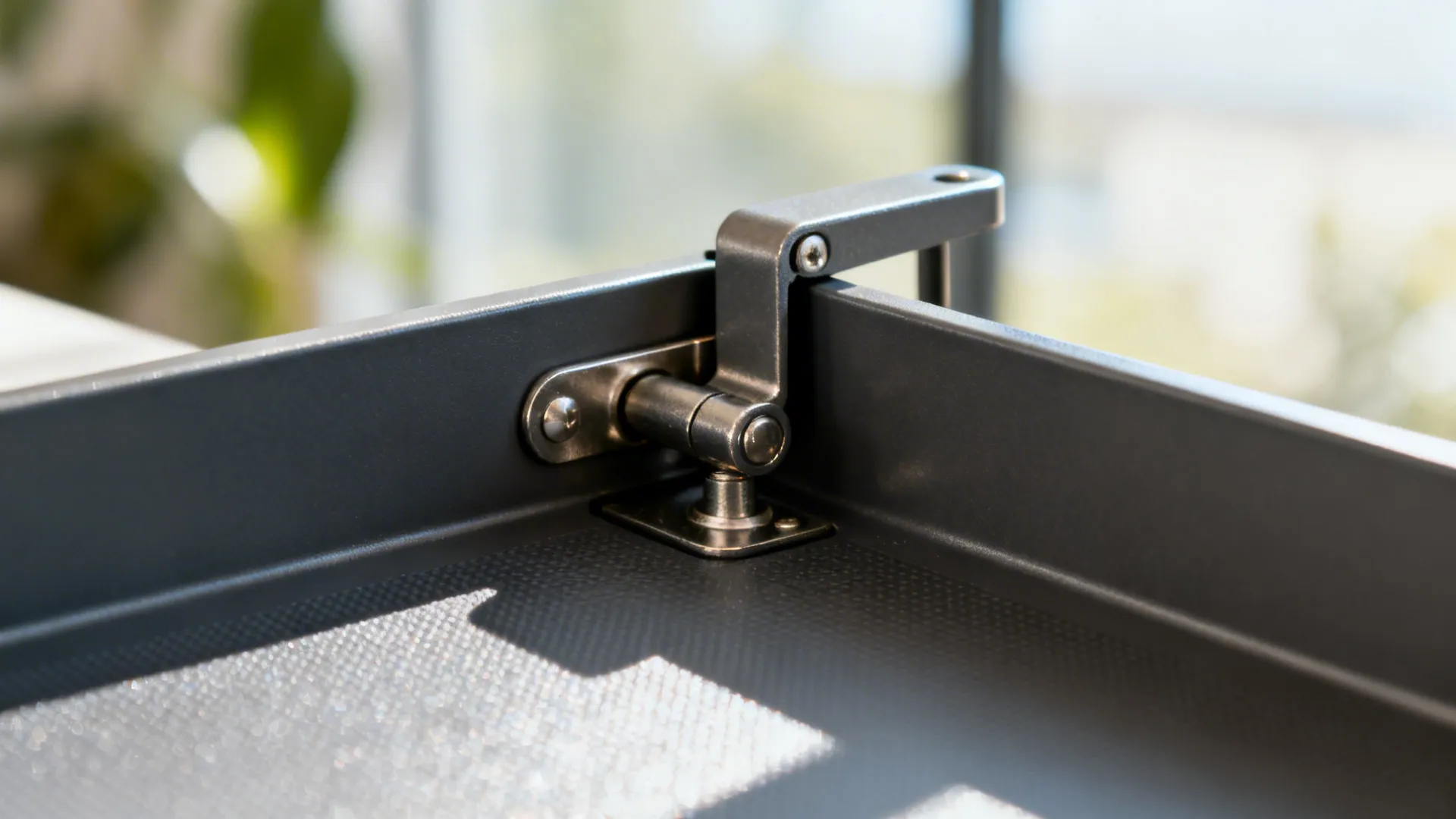 Macro view of corner swing-out tray hinge and support arm with anti-slip surface.