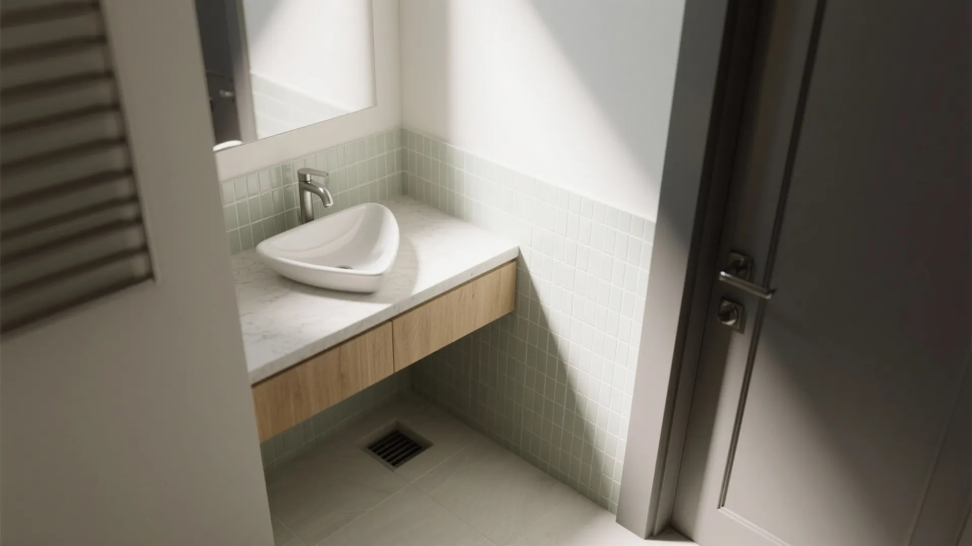 Triangular corner basin beside the entry maintaining 36-inch clearance, low-arc faucet, clean niche.