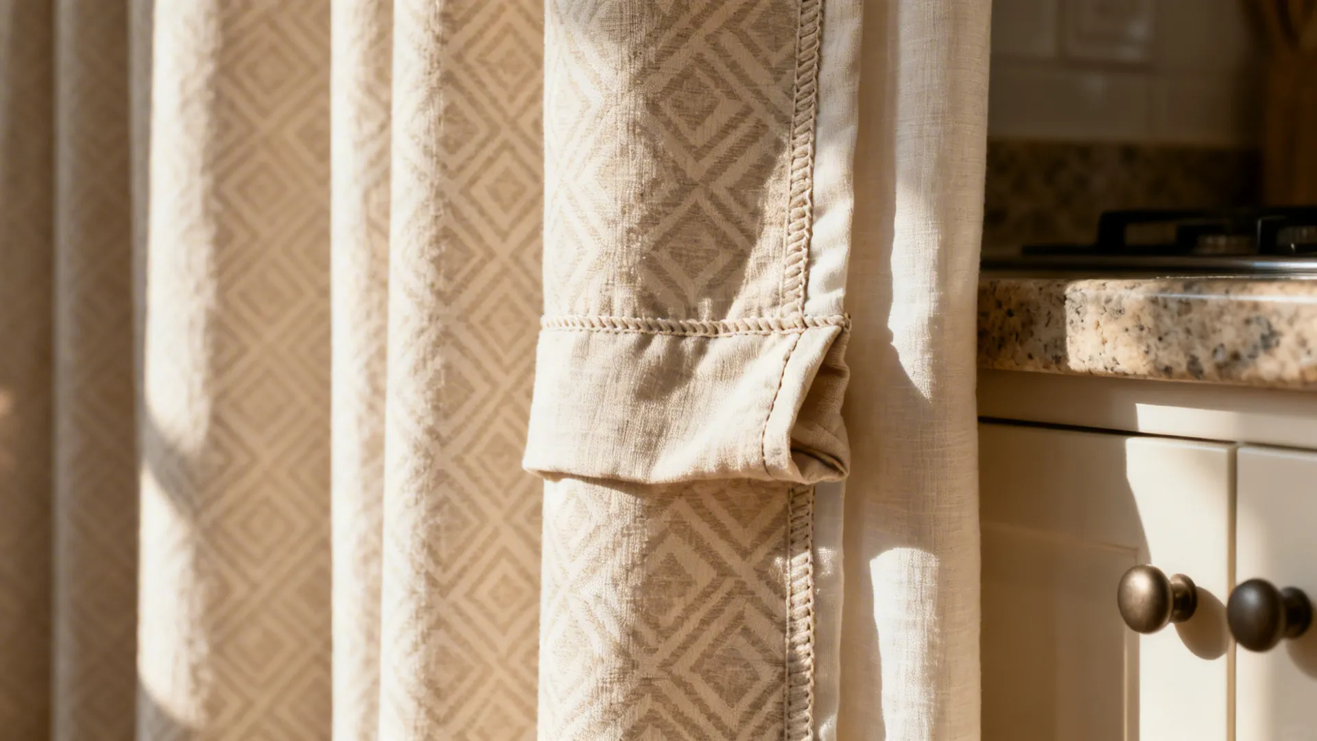 Close-up of geometric cotton drape with blackout lining and fine stitching details.