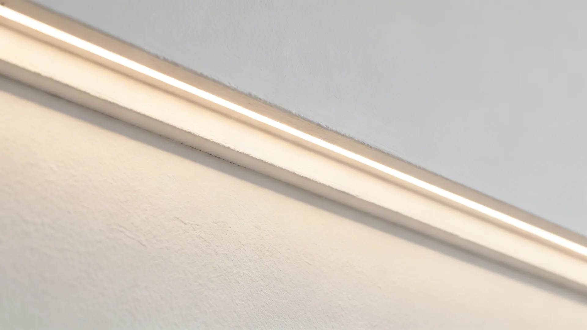 Macro of a crisp POP cove edge with smooth indirect LED glow.