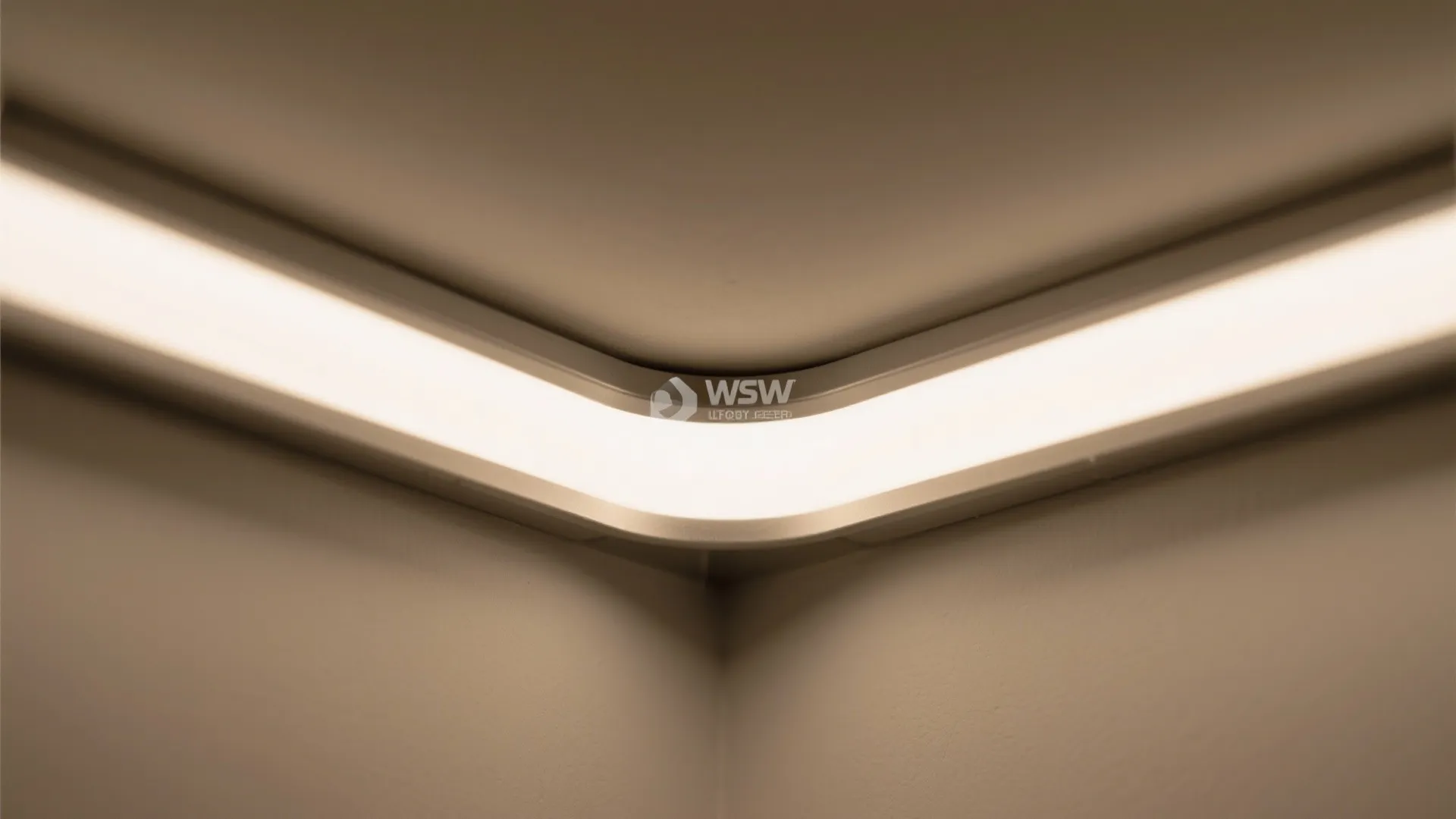 Modern ceiling light fixture hidden in a room corner providing soft warm white glow lighting