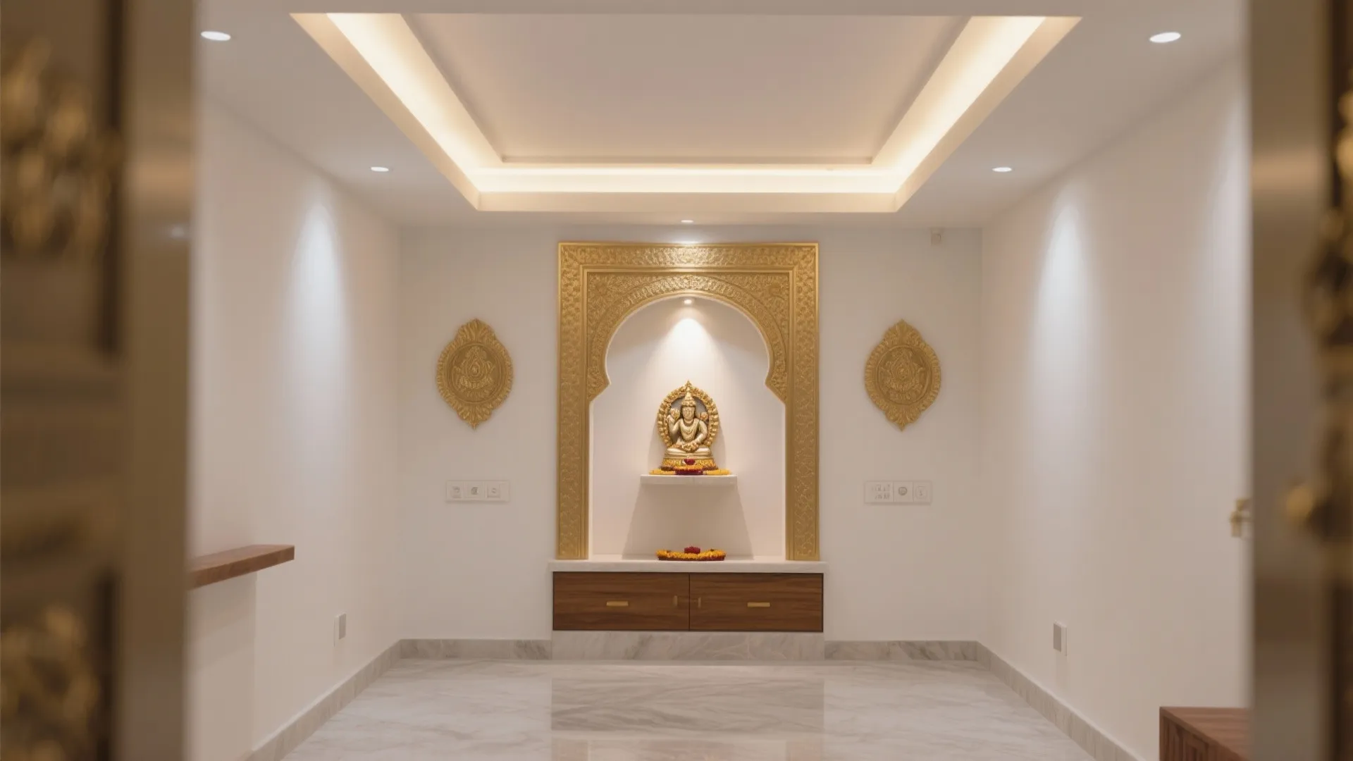 Modern room with marble floor and golden statue set inside a decorative wall niche design