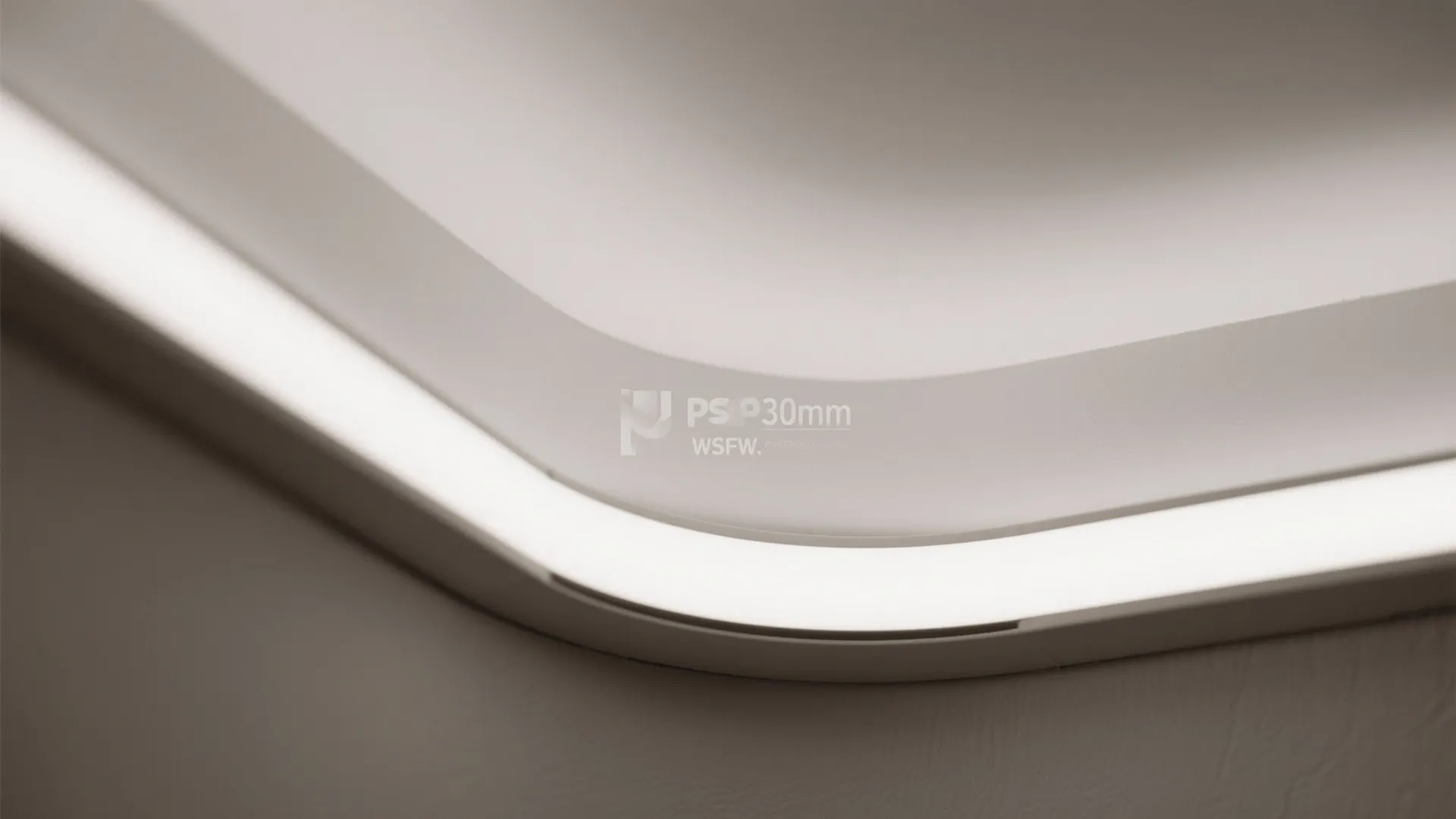 Close up view of a curved ceiling with a bright white hidden strip light fixture