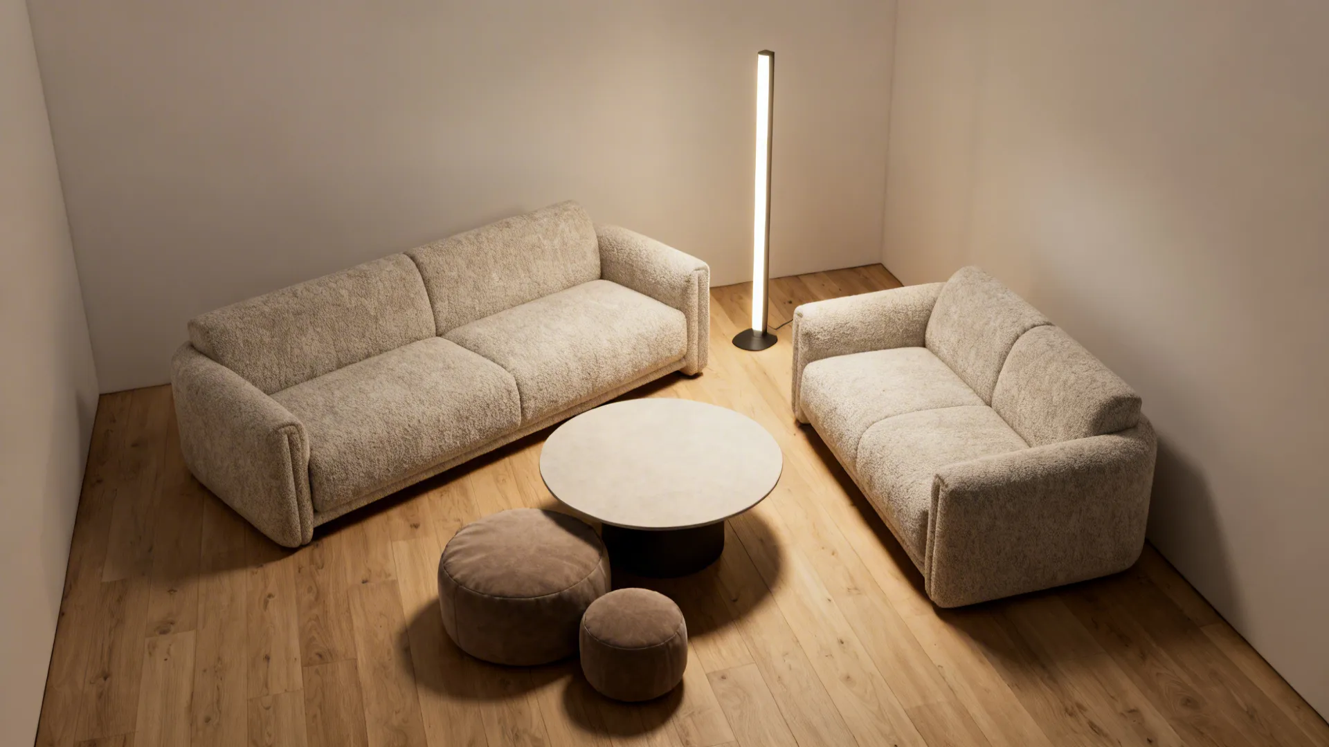 Cozy corner layout with loveseat at 45 degrees, round coffee table and tucked poufs.