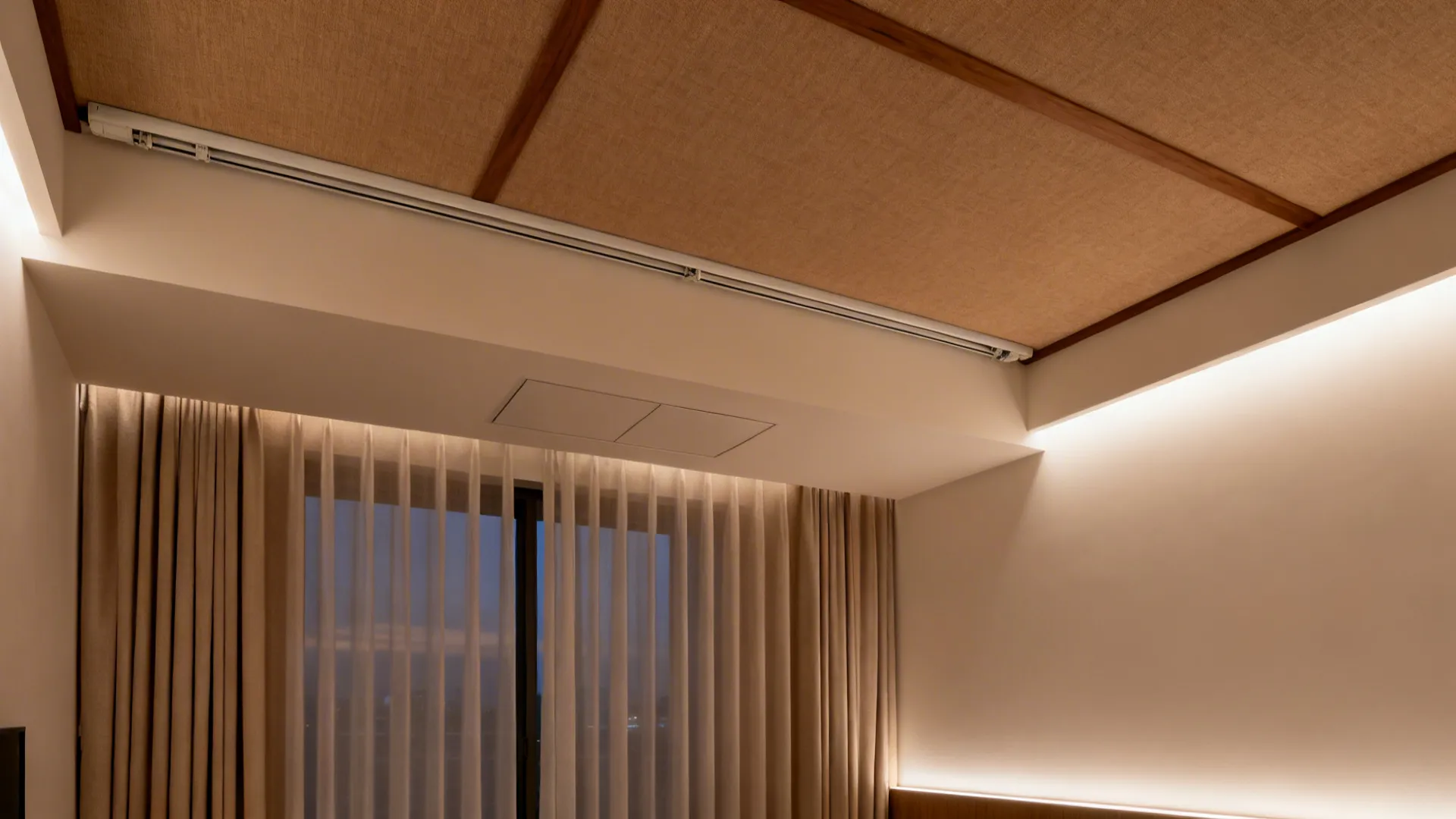 Living room with a POP perimeter trough hiding a curtain track and soft wall wash light.