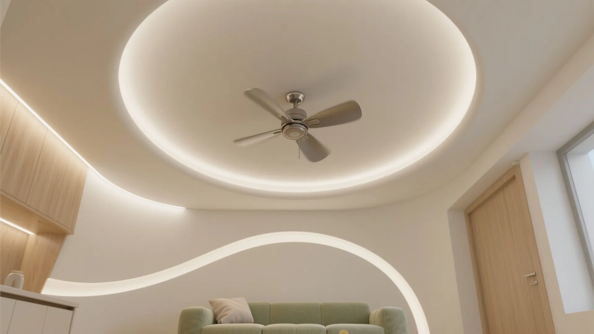 Modern white room featuring curved ceiling design with hidden light strips and a silver ceiling fan