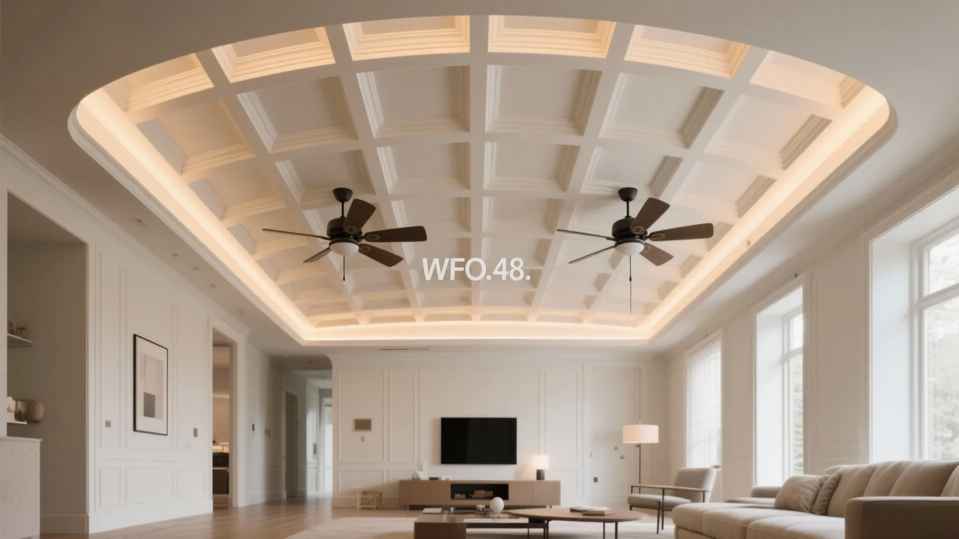 Bright white living room with recessed ceiling panel design two black ceiling fans and wall panels