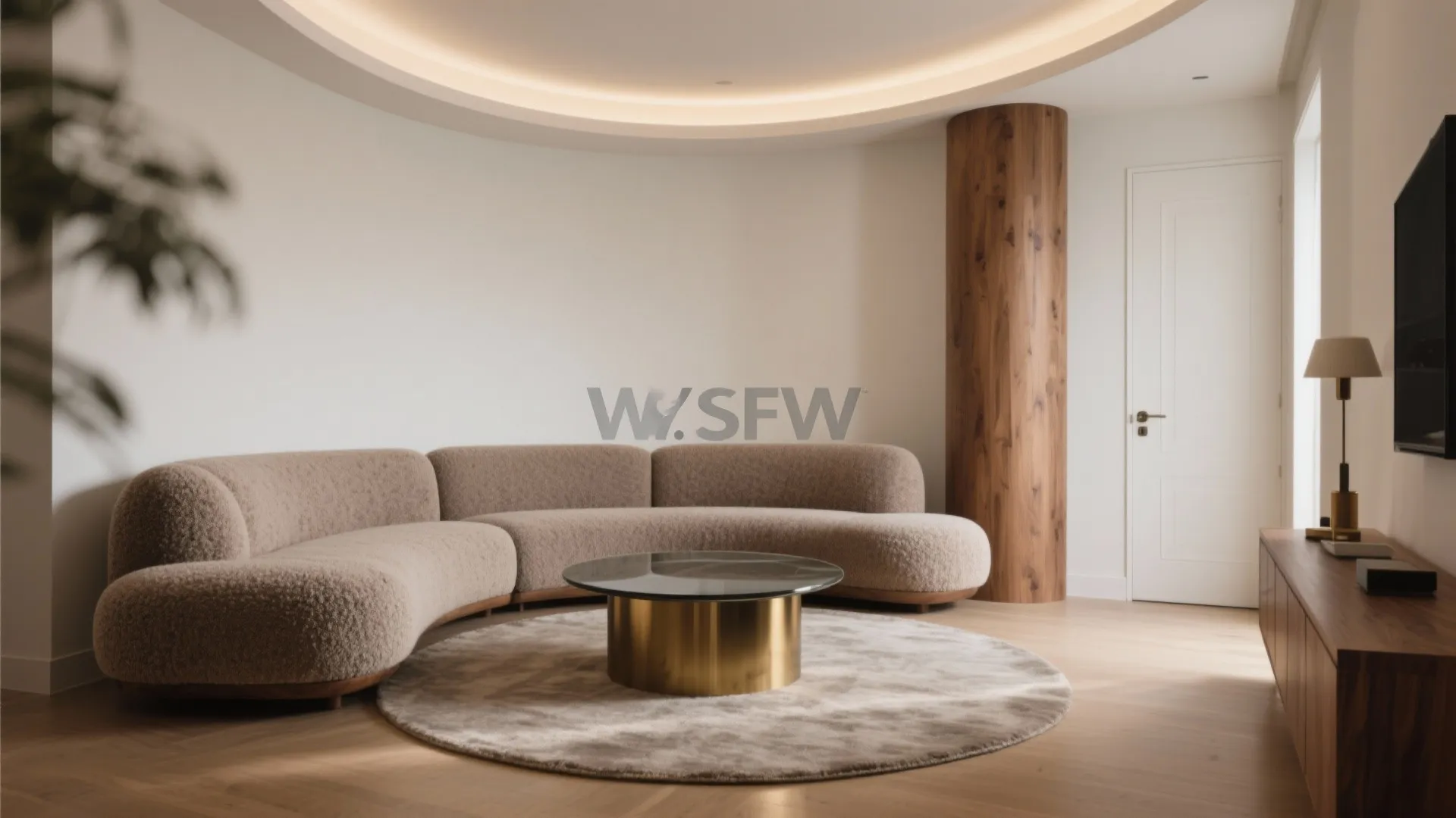 Modern room with a curved sofa, round rug, gold coffee table, wooden pillar, and cabinet
