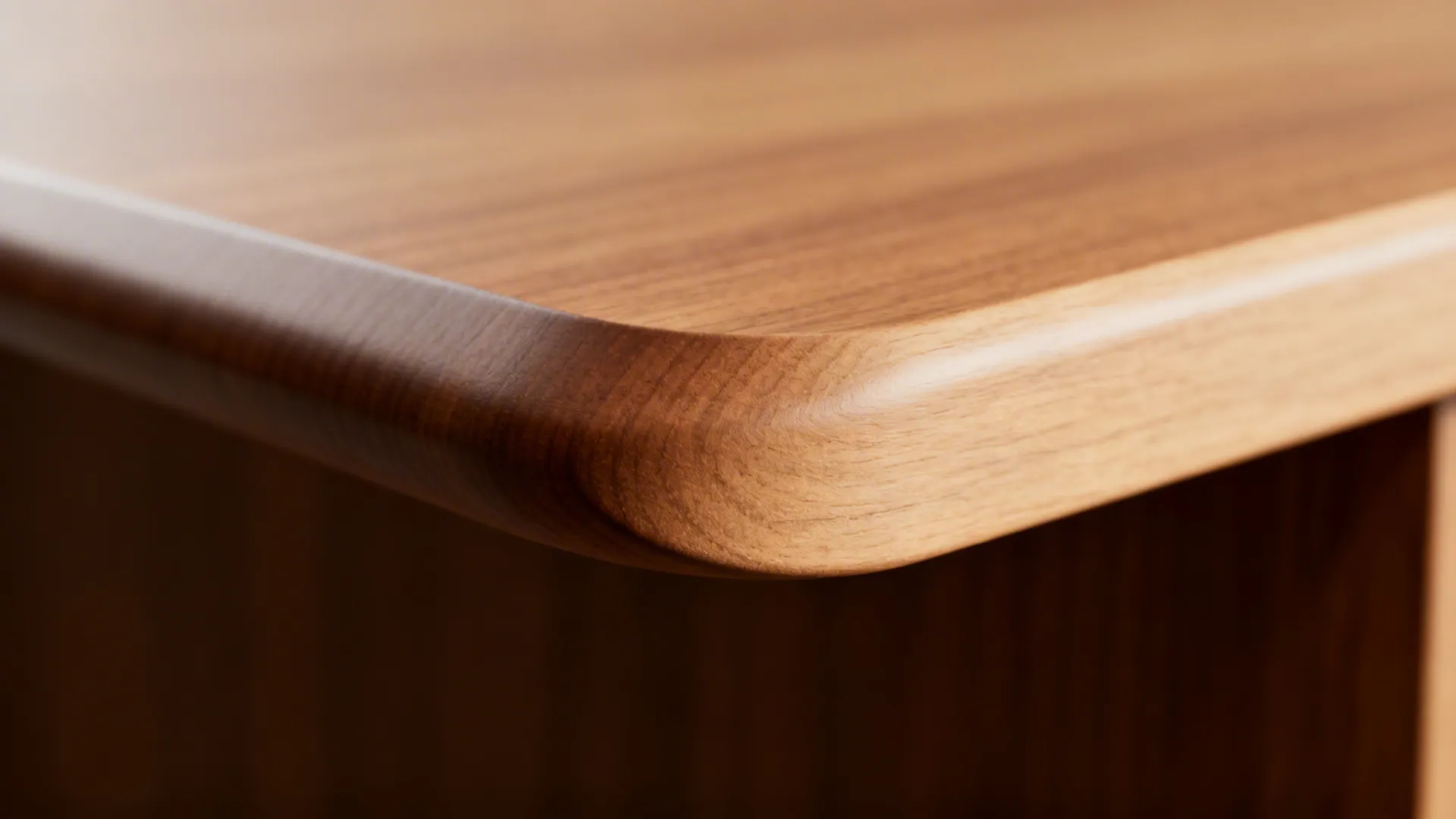 Close-up of a smooth curved edge on a T-shaped island wing showing precise radius and finish.