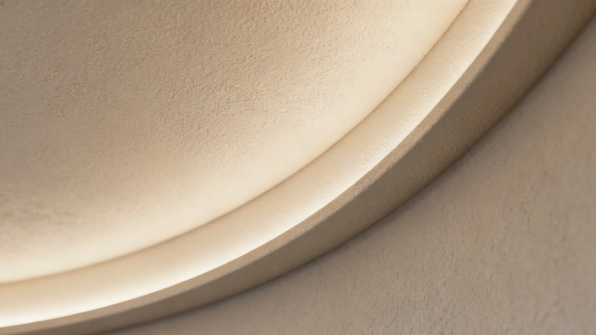 Macro of curved POP ceiling radius with concealed LED producing a smooth gradient.