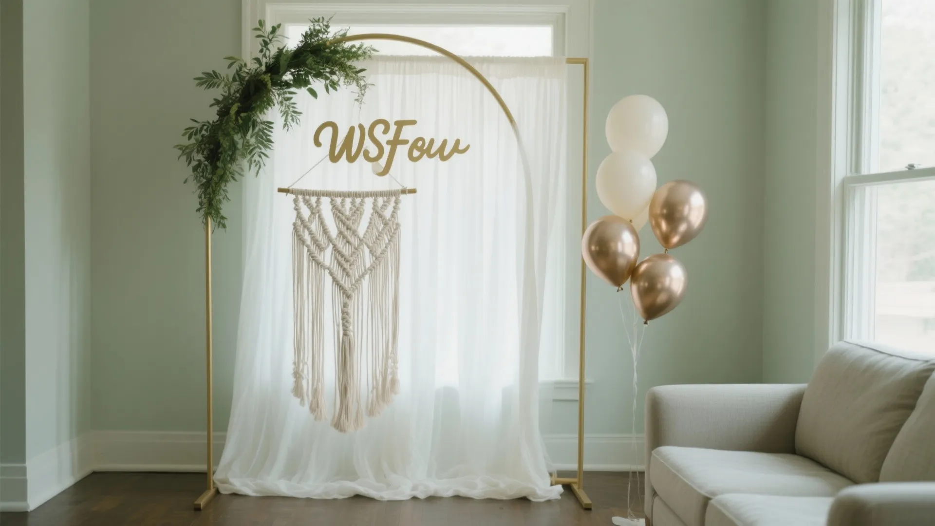 Elegant party backdrop featuring a gold frame white curtains green leaves balloons and wall decor