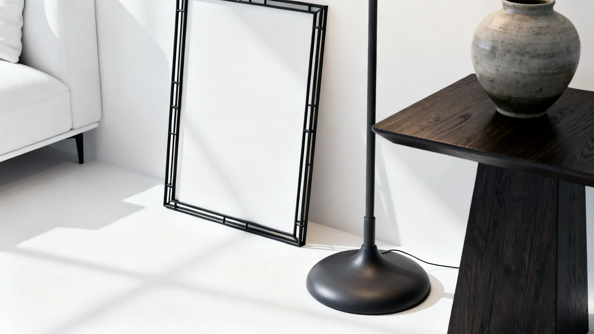 Black metal frame and dark wood side table contrasting with white furniture