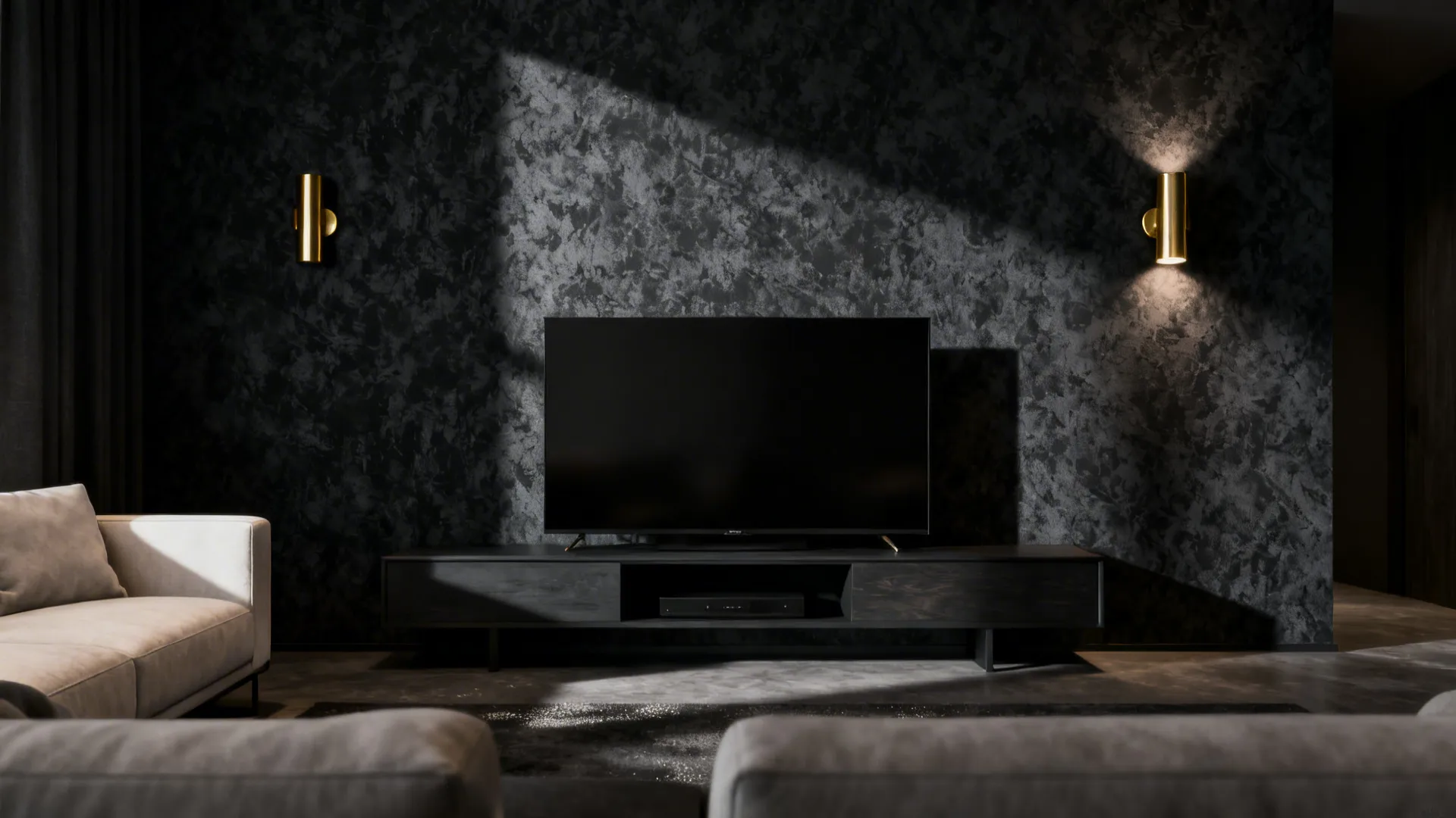 Modern living room with black tv screen dark wall panel gold wall light and grey sofa