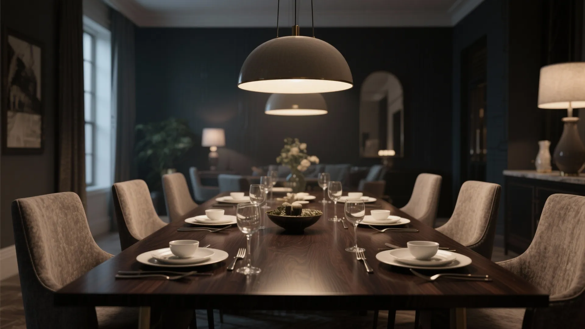 Elegant dark wood dining table set for dinner with grey chairs and modern ceiling light