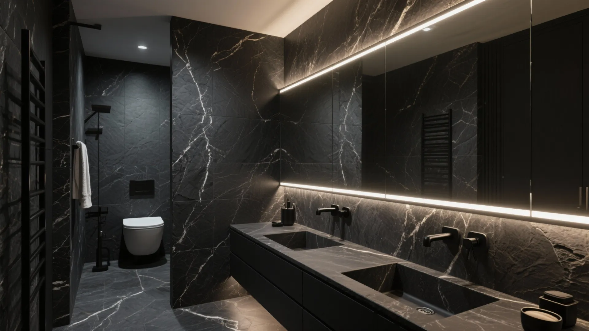 Dark slate and black marble bathroom with warm LED lighting.