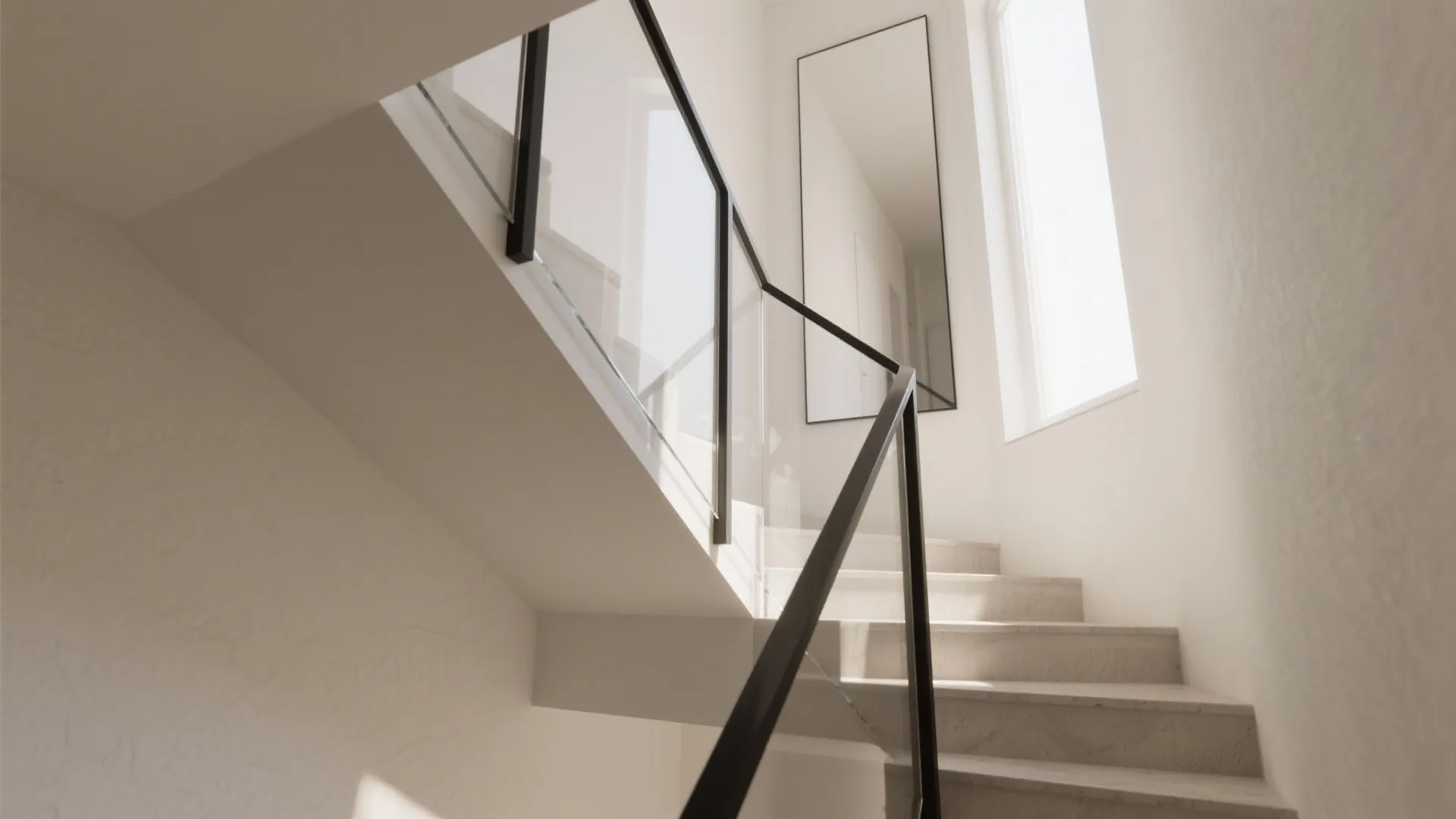 Daylight-first stairwell with mirrors and glass