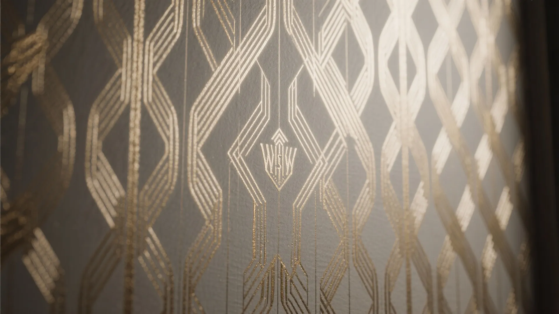 Close up view of gold geometric pattern wallpaper with elegant lines and art deco design