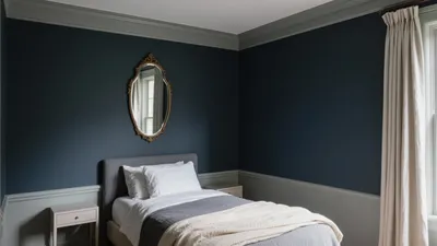 Dark Blue Bedroom with Classic Molding & Gold Mirror