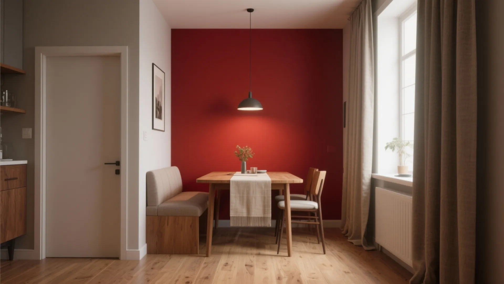 Dining room with bold red accent wall, wooden table, grey bench seat, and black ceiling light