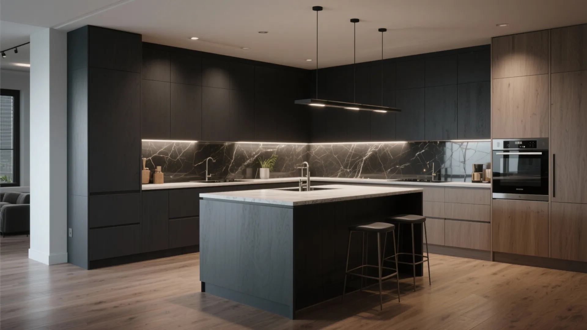 Open-plan kitchen anchored by a deep slate island with lighter perimeter cabinets and task lighting.