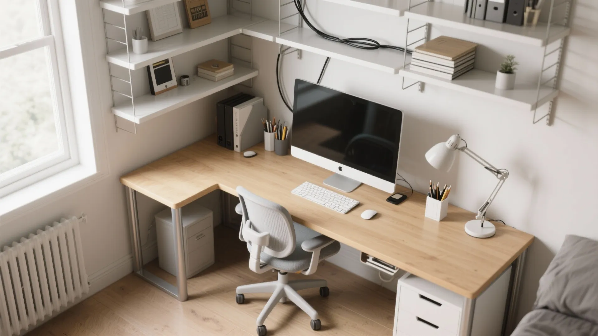 L shaped wooden desk with computer chair and white wall shelves in a home office