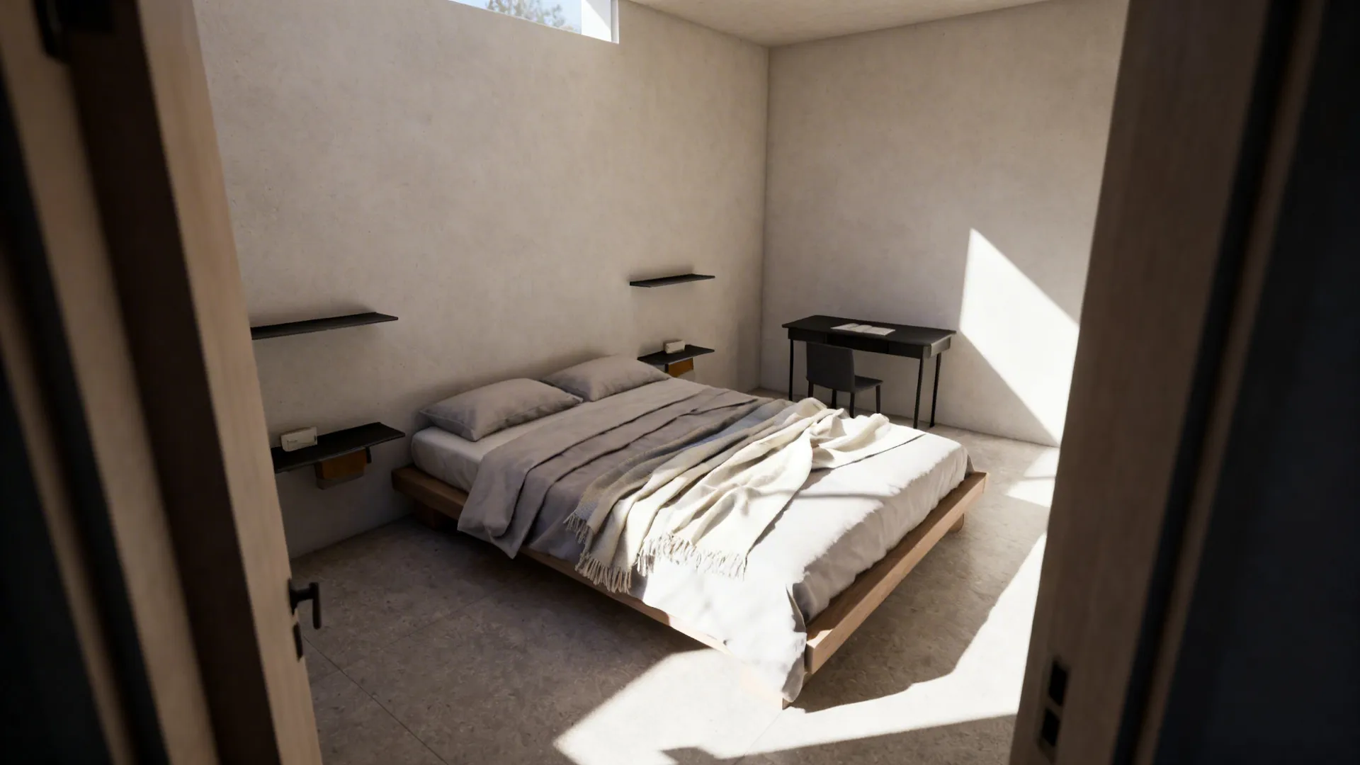 Small bedroom with a full-size bed placed diagonally, creating space for a desk and wall shelves.
