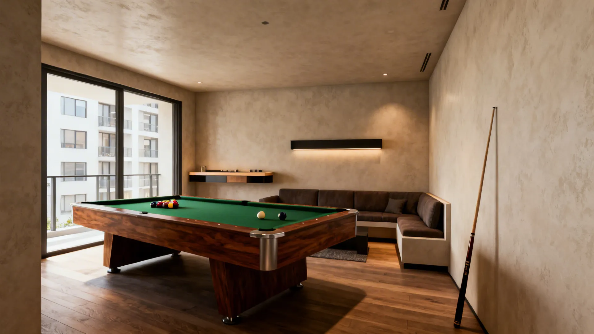 Pool table placed diagonally in a corner with a slim console and cozy seating to save space.