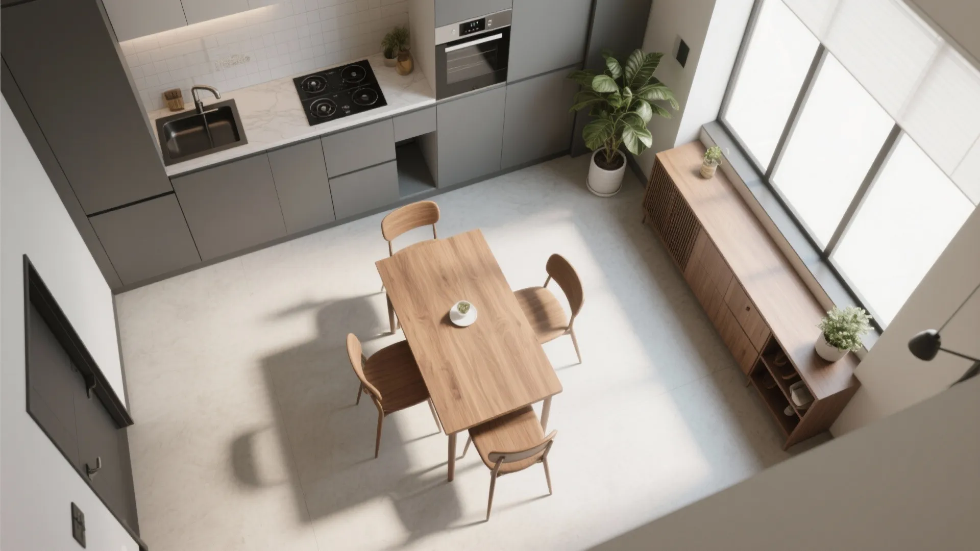 Top view of a modern kitchen showing a wooden table with chairs and grey cabinets