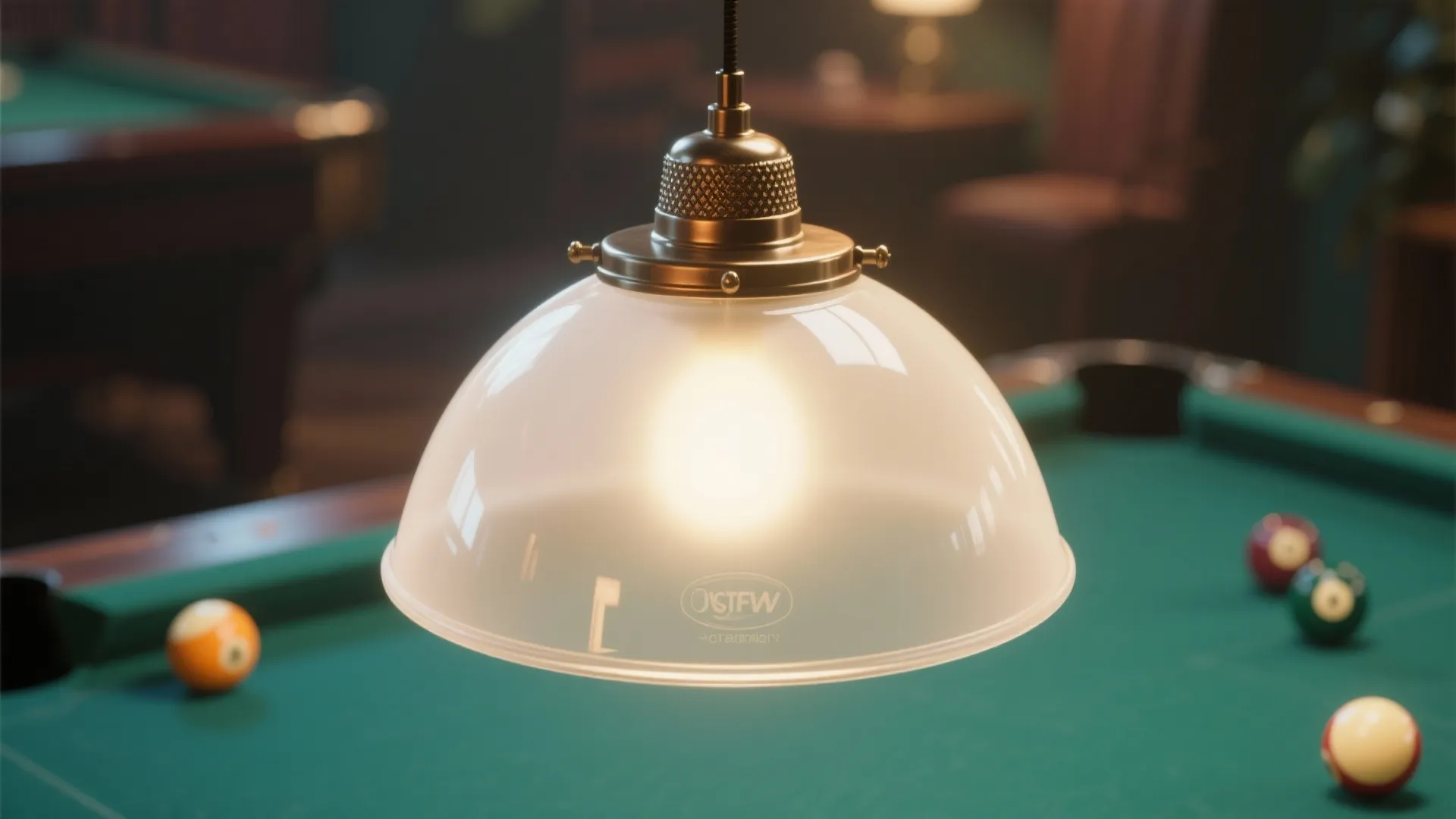 A glass ceiling light hanging over a green pool table with billiard balls in background