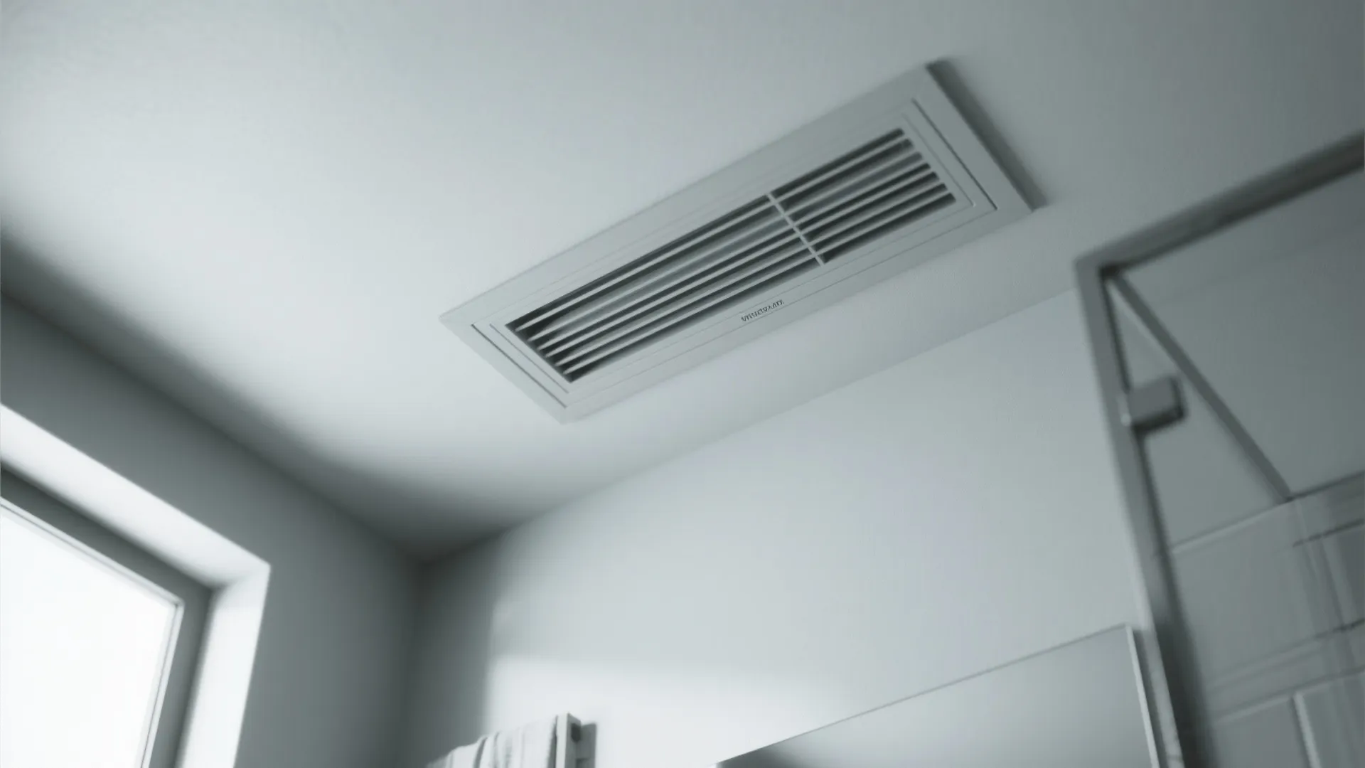Ceiling-mounted discreet extractor vent and access panel in a small bathroom